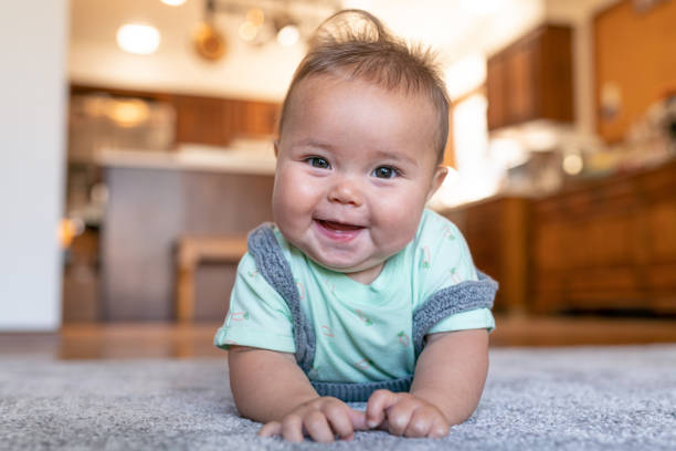 Baby lying on carpet | Florida Floor Fashions