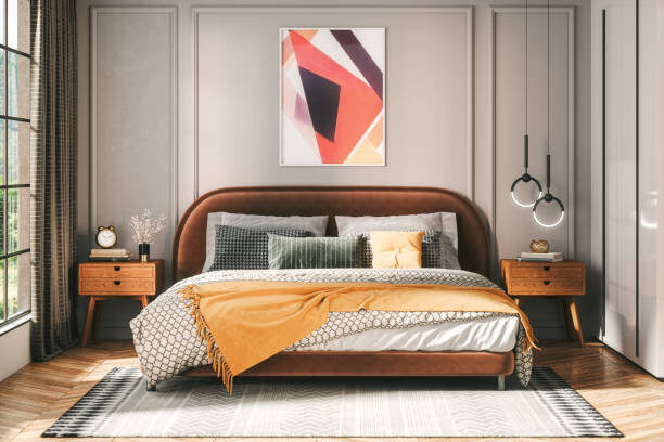 Interior of a modern cozy bedroom decorated with modern furniture with pastel tones.