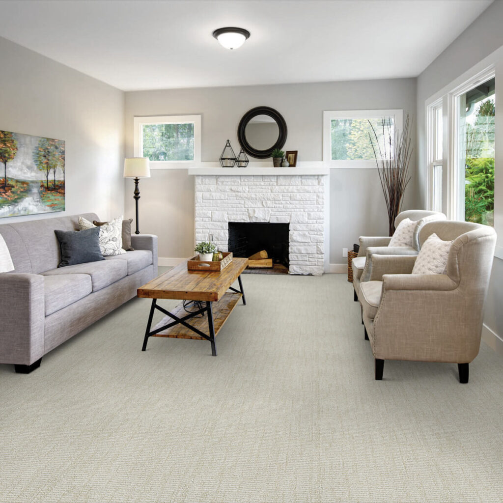 Light cream carpet in living room with fireplace