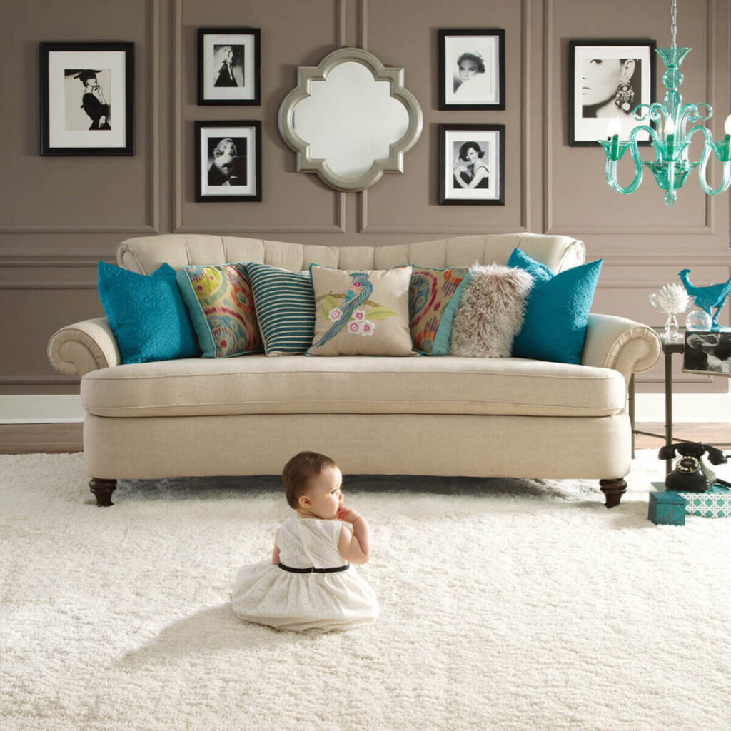 Living room with beige carpet and modern furniture.
