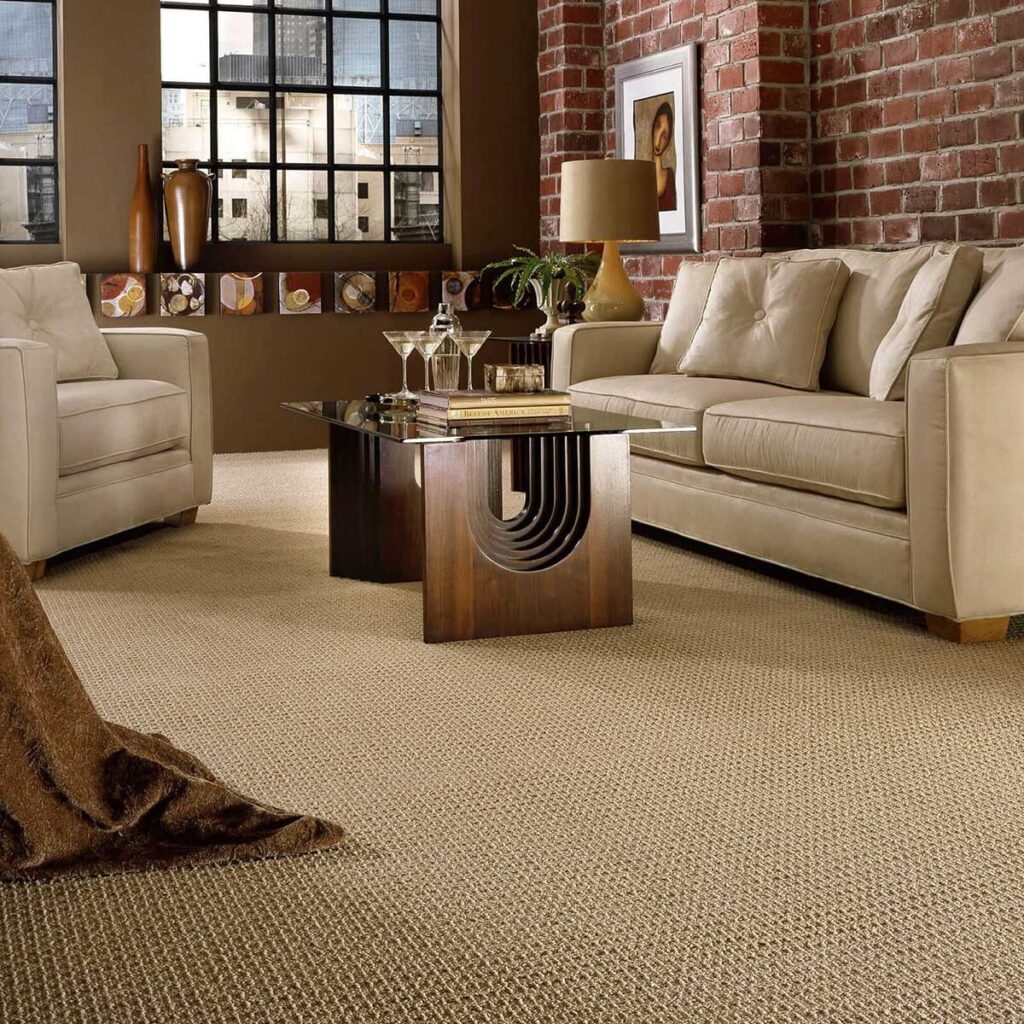 Beige carpet in loft-style living room with brick wall