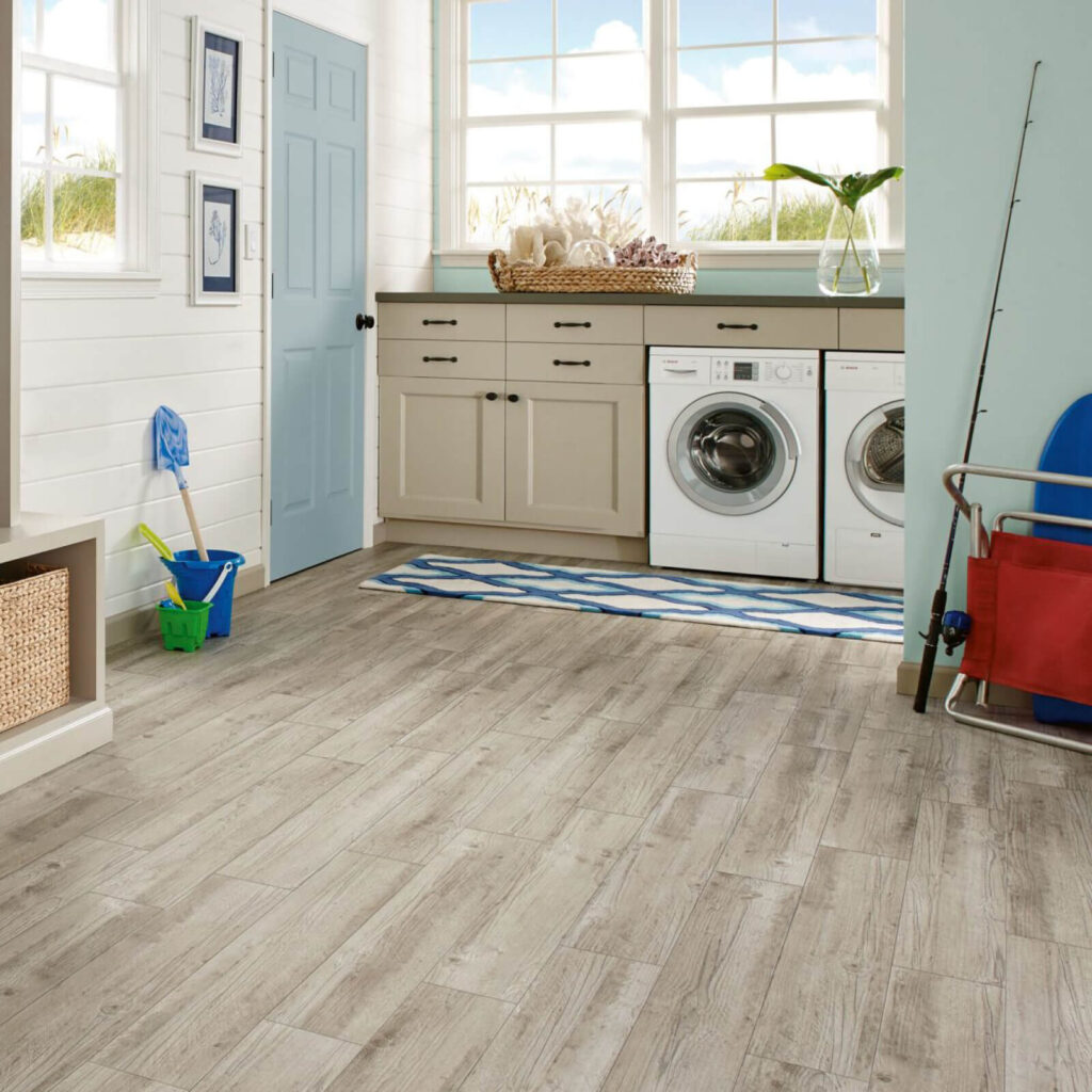 Laundry room with light gray vinyl plank flooring