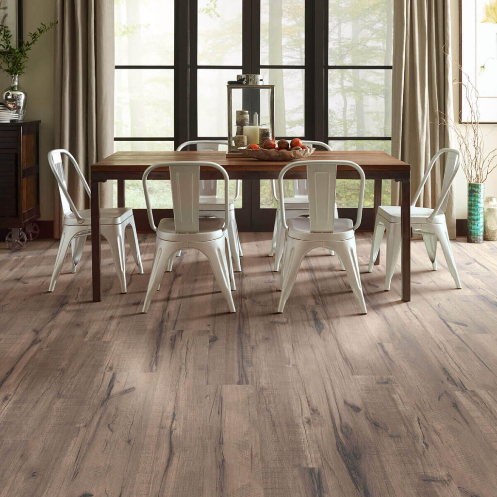 Medium brown laminate flooring in dining room