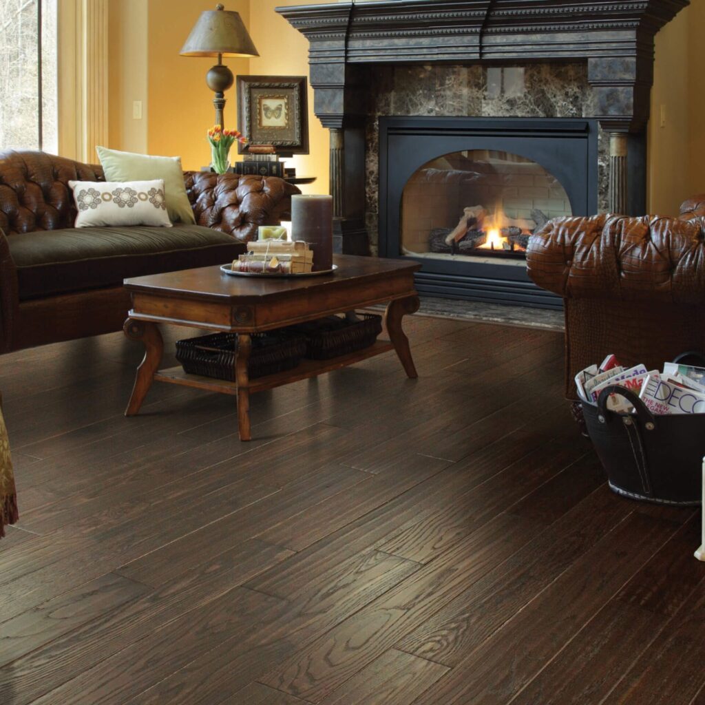 Dark hardwood floor in living room with fireplace